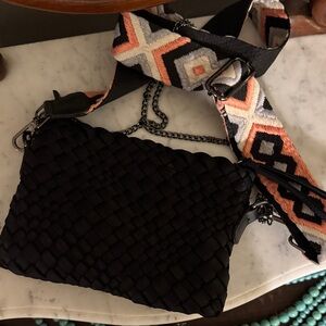 Elegant Black Woven Crossbody Bag with Patterned Strap